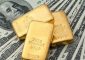 الذهب ينخفض متأثرا بارتفاع الدولار